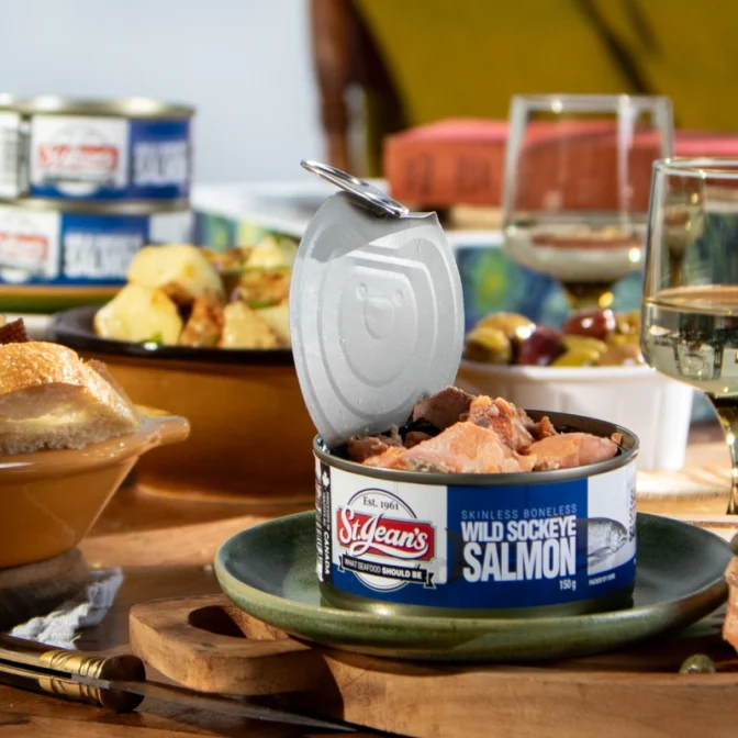 Open top Canned Wild sockeye Salmon with wine glasses